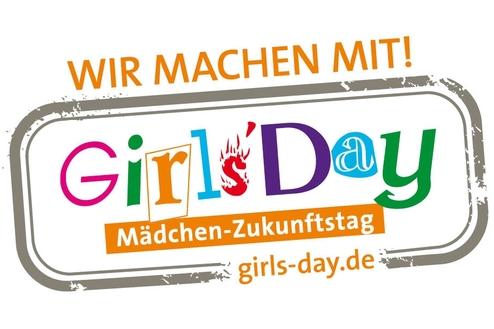 Logo für den Girls' Day mit dem Text „Wir machen mit!“, umgeben von bunten Buchstaben und einem orangefarbenen Banner.