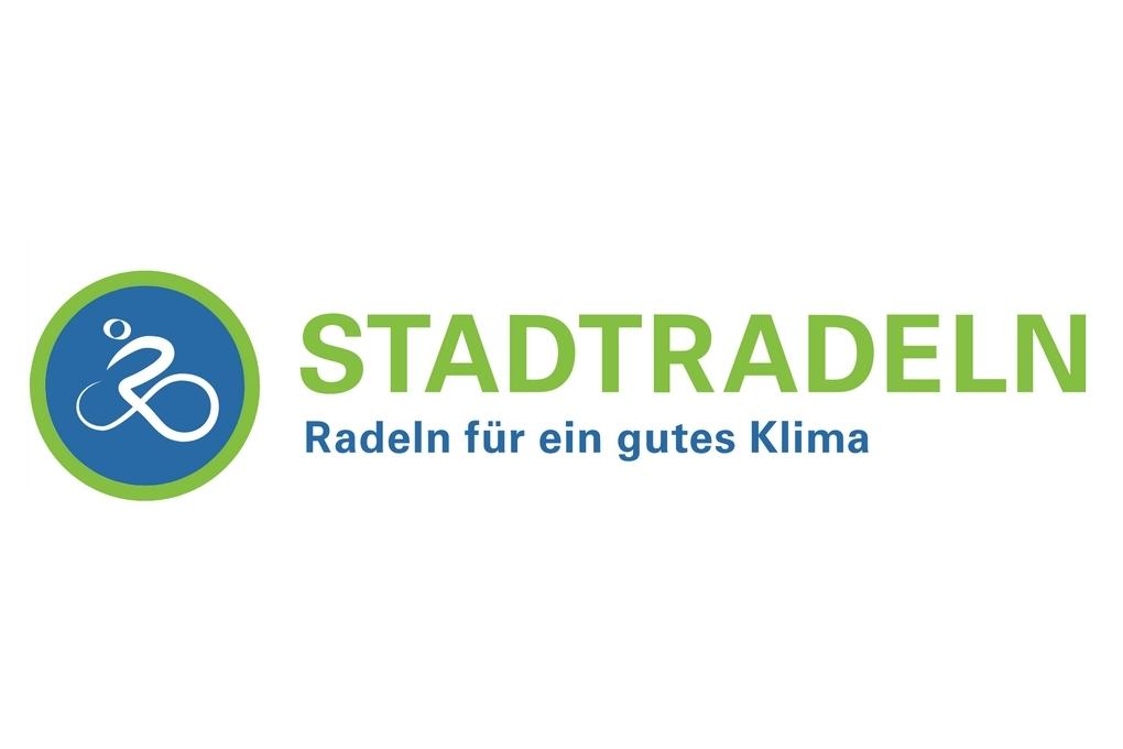 Logo der Initiative „Stadtradeln“ mit dem Slogan „Radeln für ein gutes Klima“ in grüner und blauer Schrift.