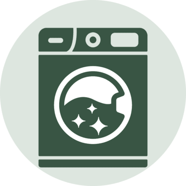 Symbol eines Frontladers mit gl&auml;nzender Trommel und blasenf&ouml;rmigen Elementen auf gr&uuml;nem Hintergrund.