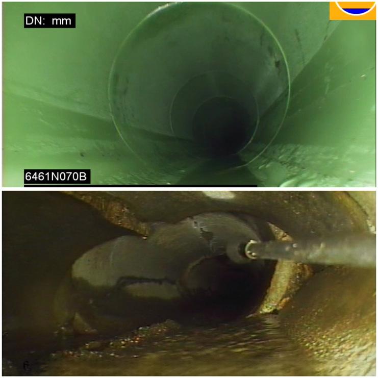 Blick in einen grünen Abwasserkanal, oben mit glattem Innenrand, unten mit Ablagerungen und verschmutzter Oberfläche.