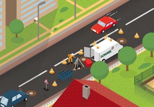 Bauarbeiter arbeitet an einer Straßenöffnung, umgeben von Verkehrsabsperrungen und einem Fahrzeug der Firma Dommel.